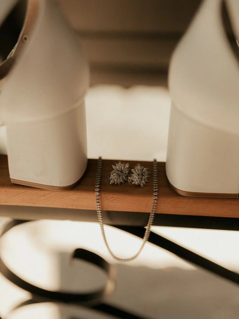 Bridal shoes, earrings and a necklace