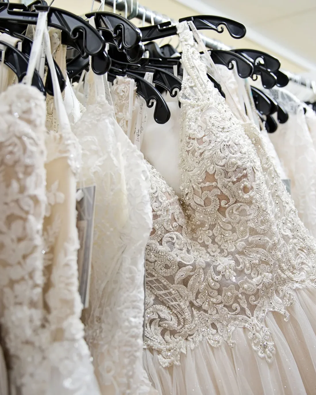 Lace wedding gowns on display